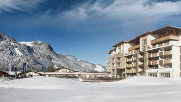 Experience the mountain resort's stunning architecture with balconies offering breathtaking views of the surrounding peaks.