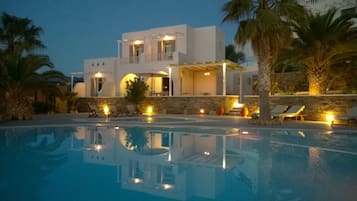 Seasonal outdoor pool, open 10:00 AM to 8:00 PM, pool umbrellas