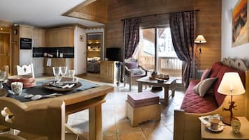 Apartment, 3 Bedrooms | Living area | 60-cm flat-screen TV with digital channels, TV