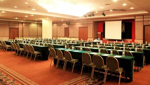 A conference room with multiple tables and chairs, equipped with water bottles and nameplates. - Travelodge Ipoh (Ipoh)