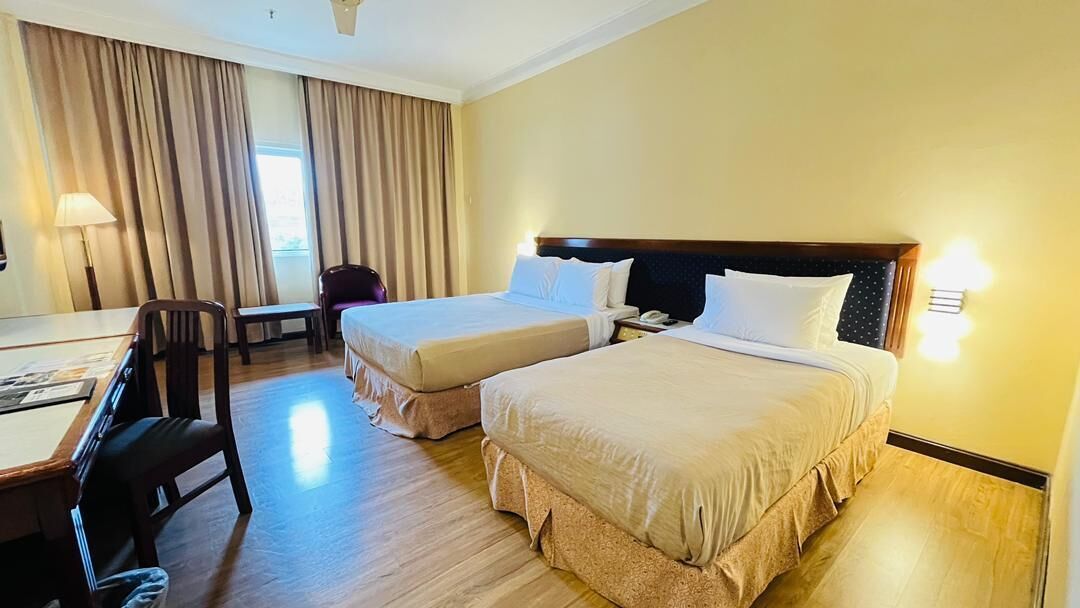 Superior Triple Room | Minibar, in-room safe, desk, blackout curtains