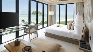 A modern hotel room with a large bed, a desk, and a television. - Idyllic Concept Resort (Koh Lipe)