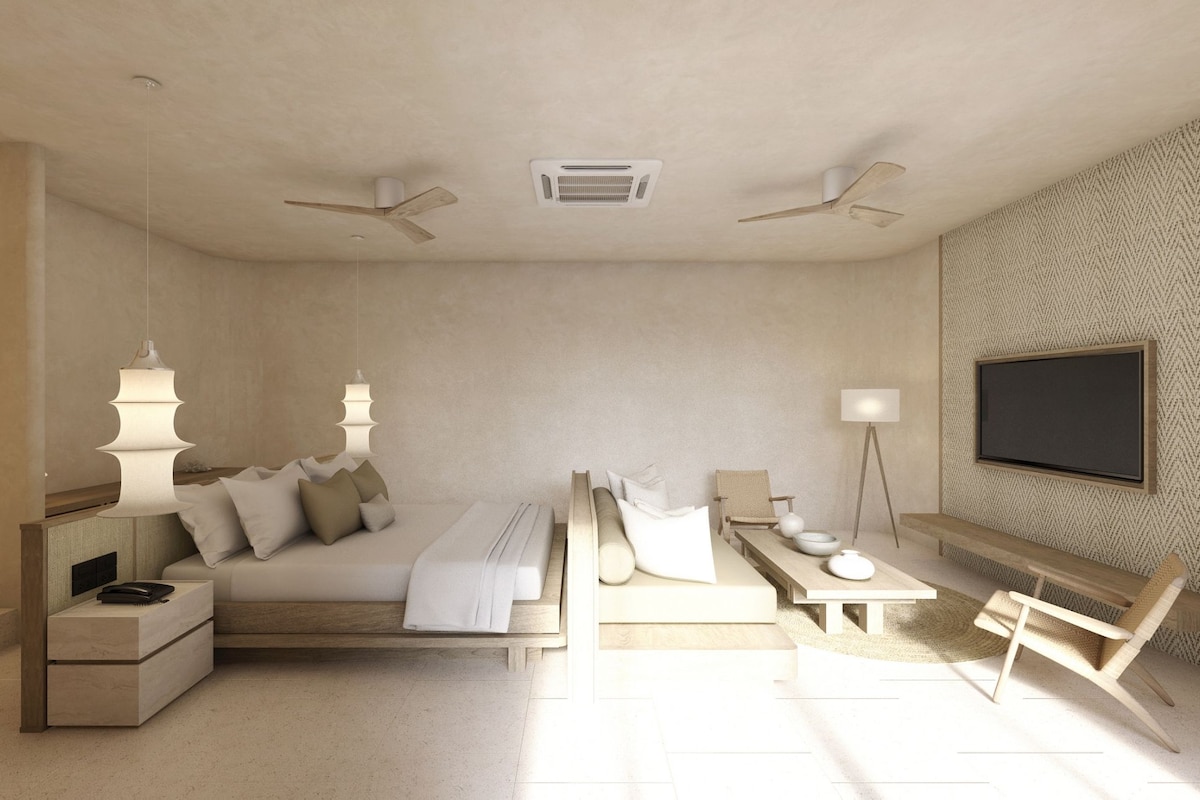 Une chambre moderne comprenant un lit, des tables de chevet, un bureau, une chaise, un téléviseur et des ventilateurs de plafond.