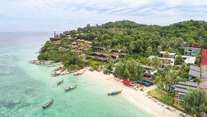 A coastal resort with beach access, boats, and lush greenery. - Idyllic Concept Resort (Koh Lipe)