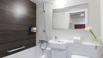 Combined shower/tub, free toiletries, hair dryer, slippers