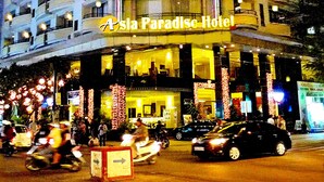 A multi-story hotel with a prominent sign reading "Asia Paradise Hotel." - Asia Paradise Hotel (Nha Trang)