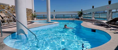 Outdoor pool, pool umbrellas, sun loungers