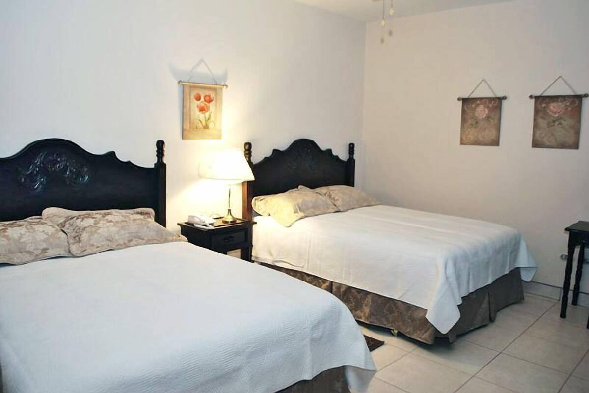 Superior Quadruple Room, 2 Queen Beds | Premium bedding, in-room safe, desk, iron/ironing board (on request)