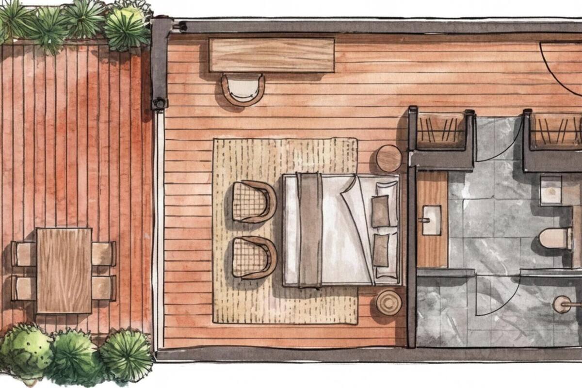 A deck with a table and chairs, a small seating area with a rug, and a water feature.