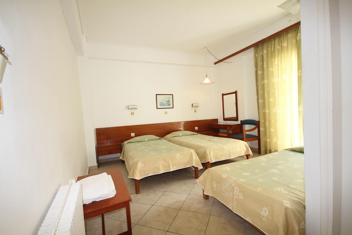 Triple Room | Pillowtop beds, in-room safe, blackout drapes
