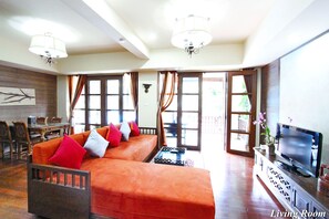 Suite, 2 Bedrooms, Jetted Tub | Living room | 40-inch flat-screen TV with cable channels, TV - Shewe Wana Suite Resort (Chiang Mai)