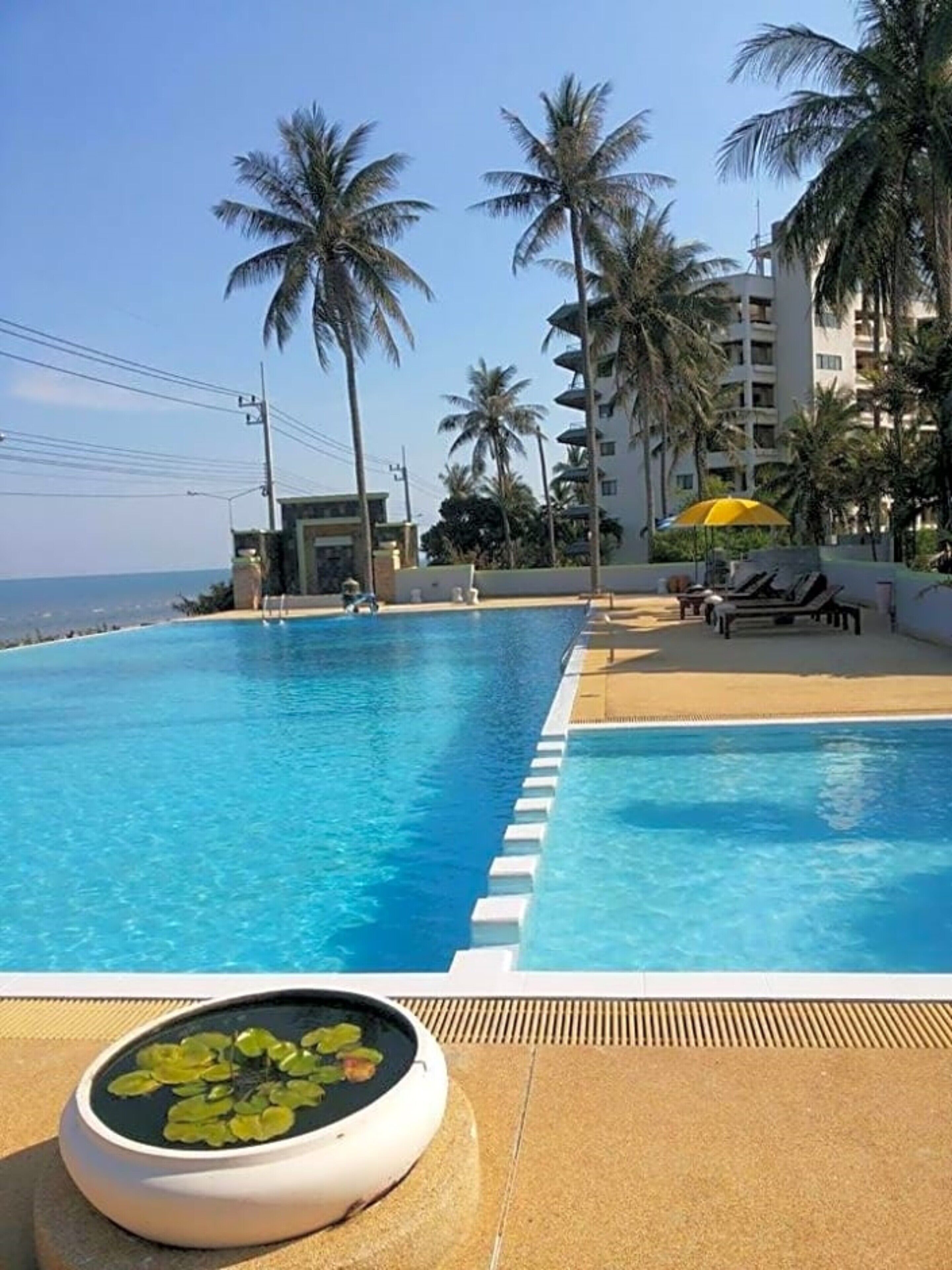 outdoor pool, open 8:00 am to 8:00 pm, pool umbrellas, pool loungers