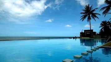 Outdoor pool, open 8:00 AM to 8:00 PM, pool umbrellas, sun loungers