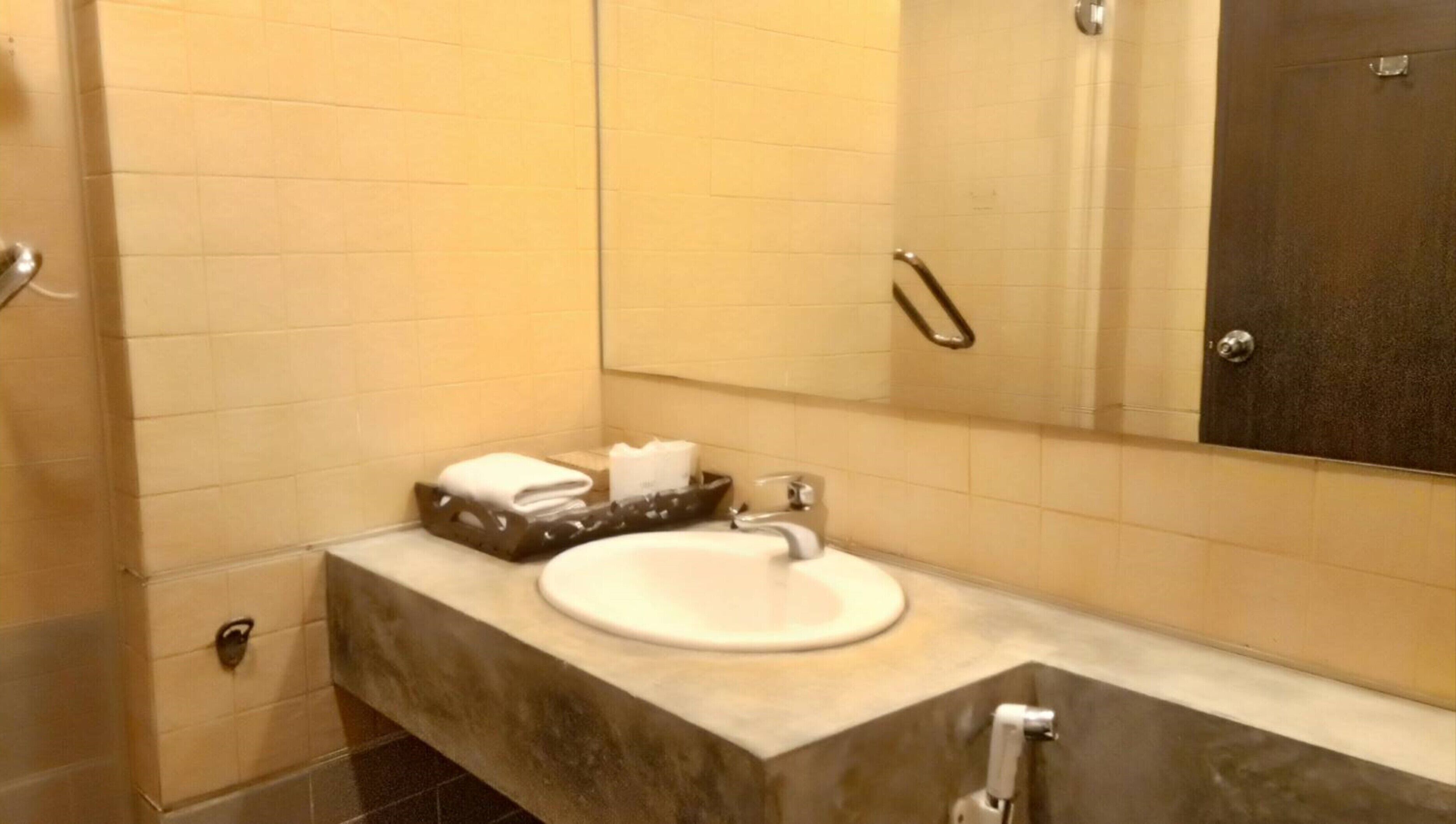 deluxe seaview room | bathroom | shower, free toiletries, hair dryer, slippers