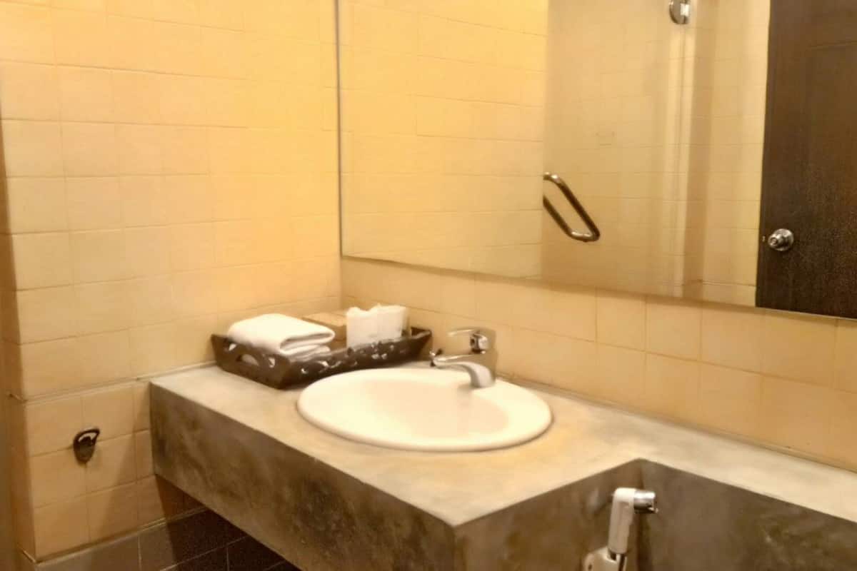 deluxe seaview room | bathroom | shower, free toiletries, hair dryer, slippers