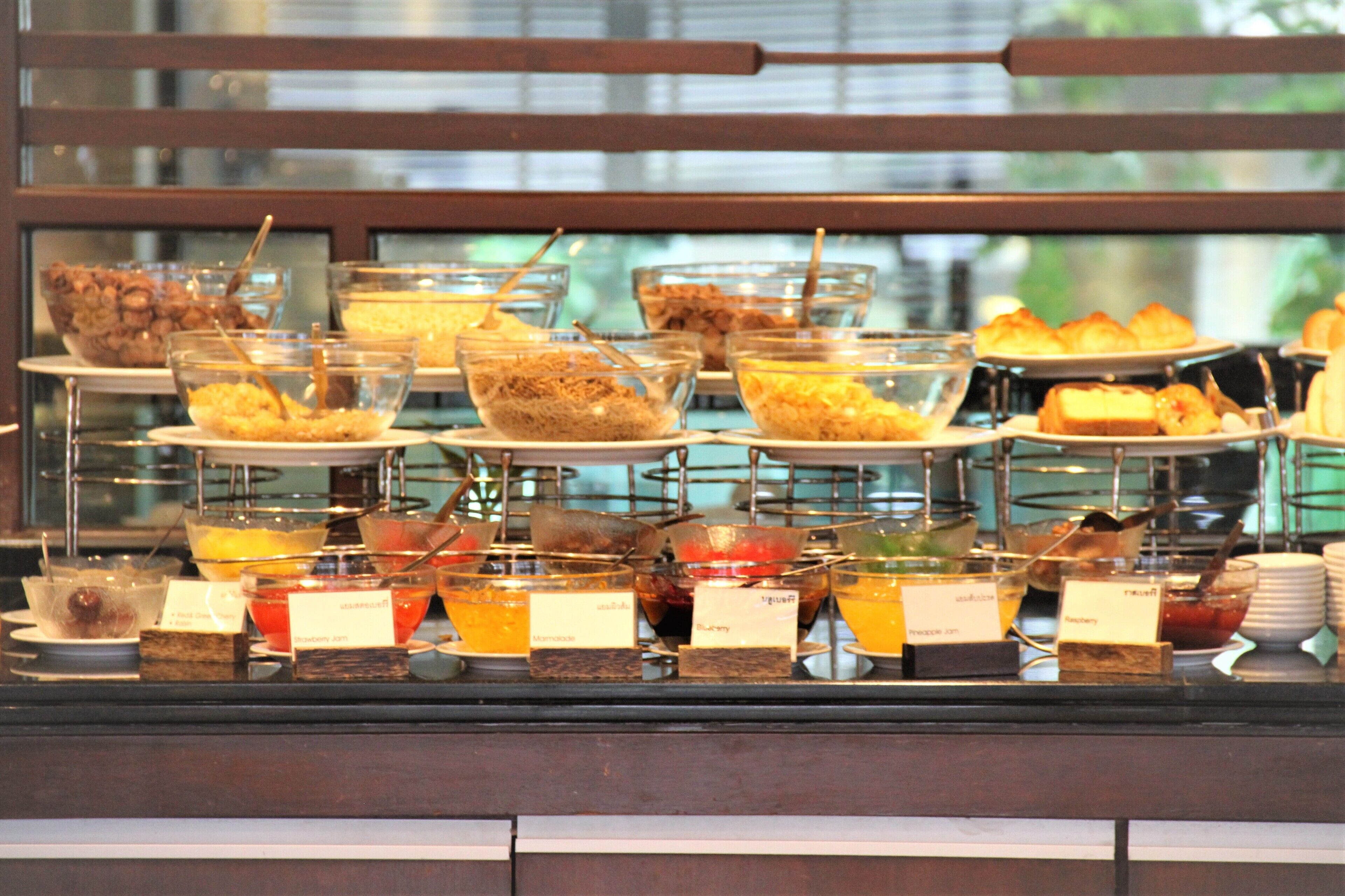 A buffet with various food items and beverages.