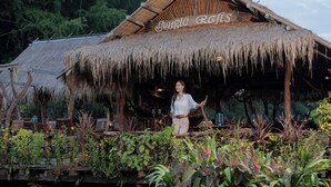A rustic thatched-roof structure with a sign reading "Jungle Crafts". - River Kwai Jungle Rafts (Sai Yok)