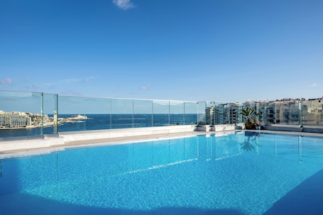 Indoor pool, seasonal outdoor pool, pool umbrellas, pool loungers