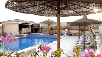 Outdoor pool, pool umbrellas, pool loungers