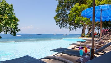 Outdoor pool, pool umbrellas, sun loungers