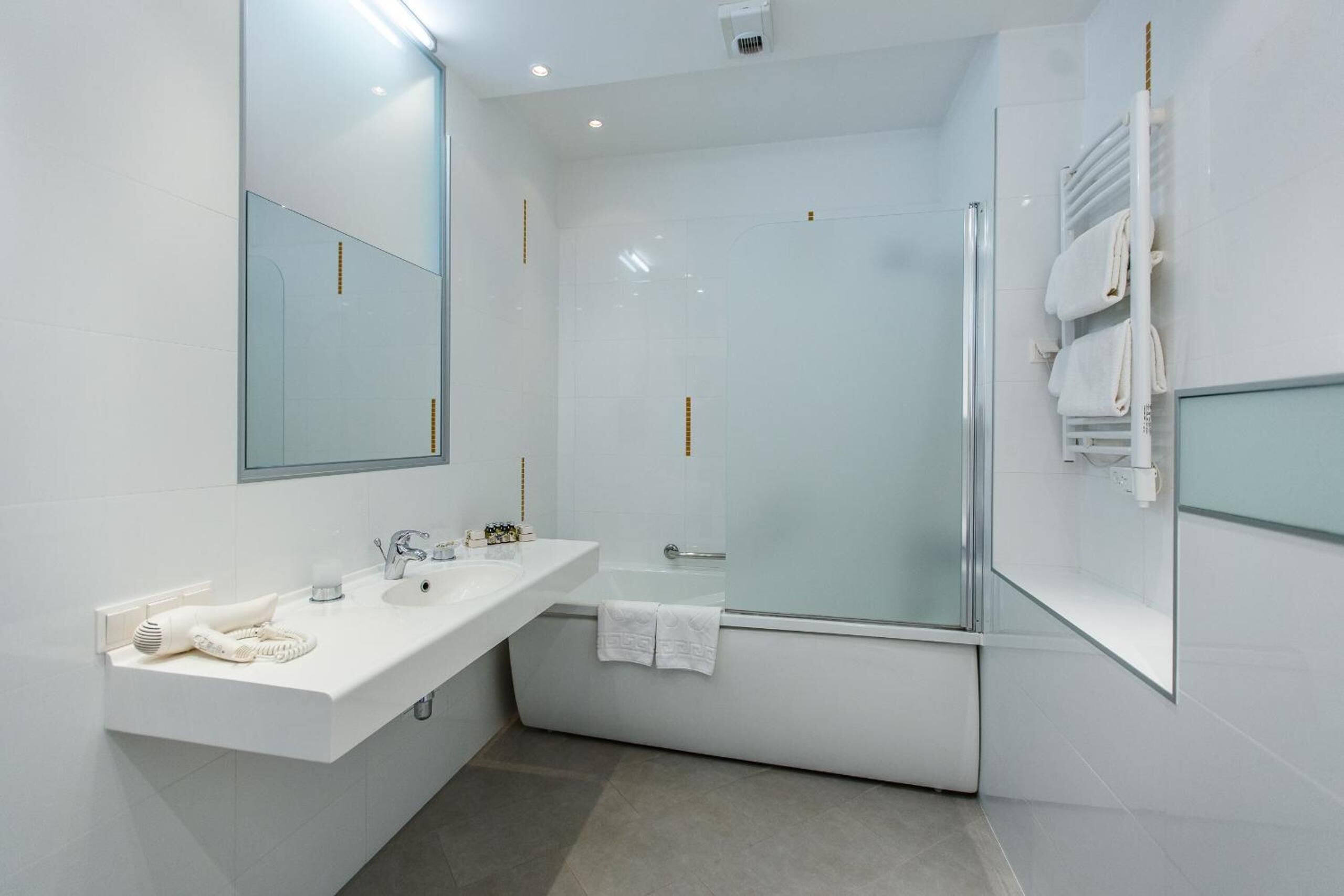 designer toiletries, hair dryer, bathrobes, slippers