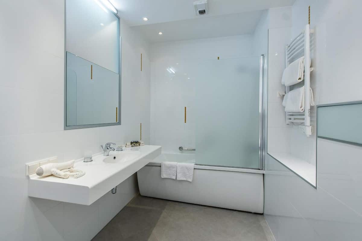 designer toiletries, hair dryer, bathrobes, slippers