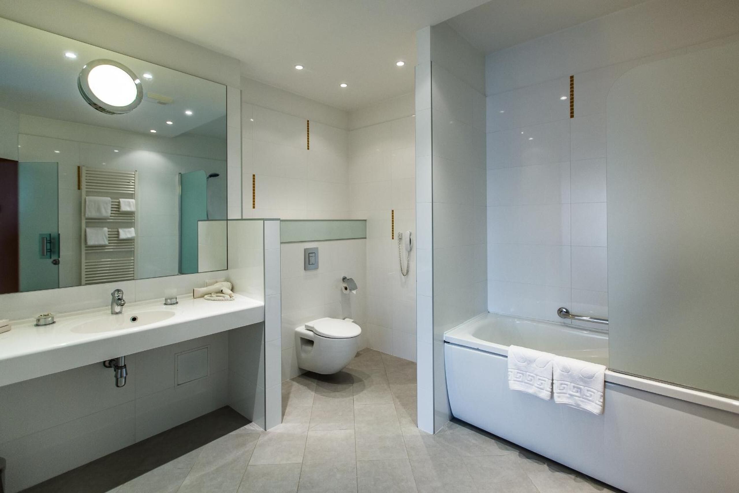 designer toiletries, hair dryer, bathrobes, slippers