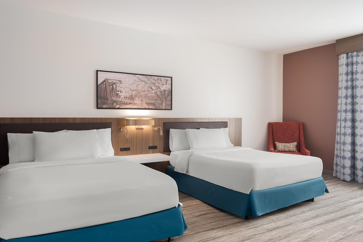 Room, 2 Queen Beds (Evolution) | Blackout drapes, iron/ironing board, free cribs/infant beds, free WiFi