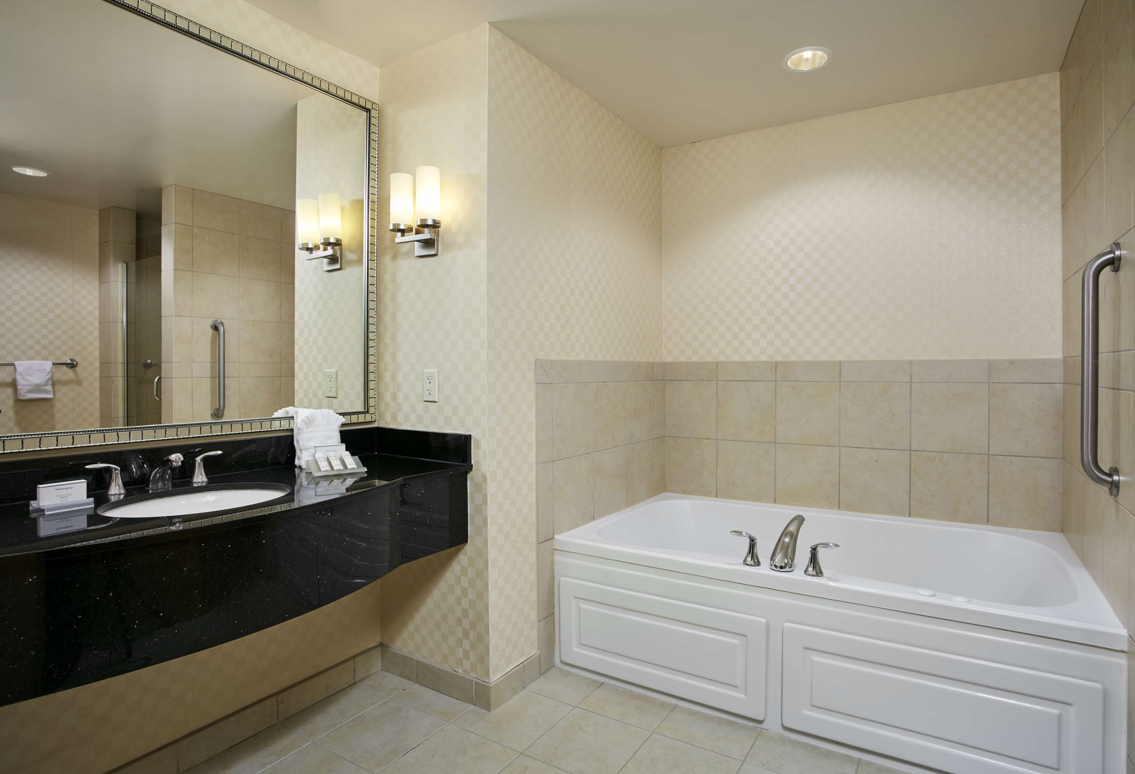 suite, 1 king bed | bathroom | designer toiletries, hair dryer, towels