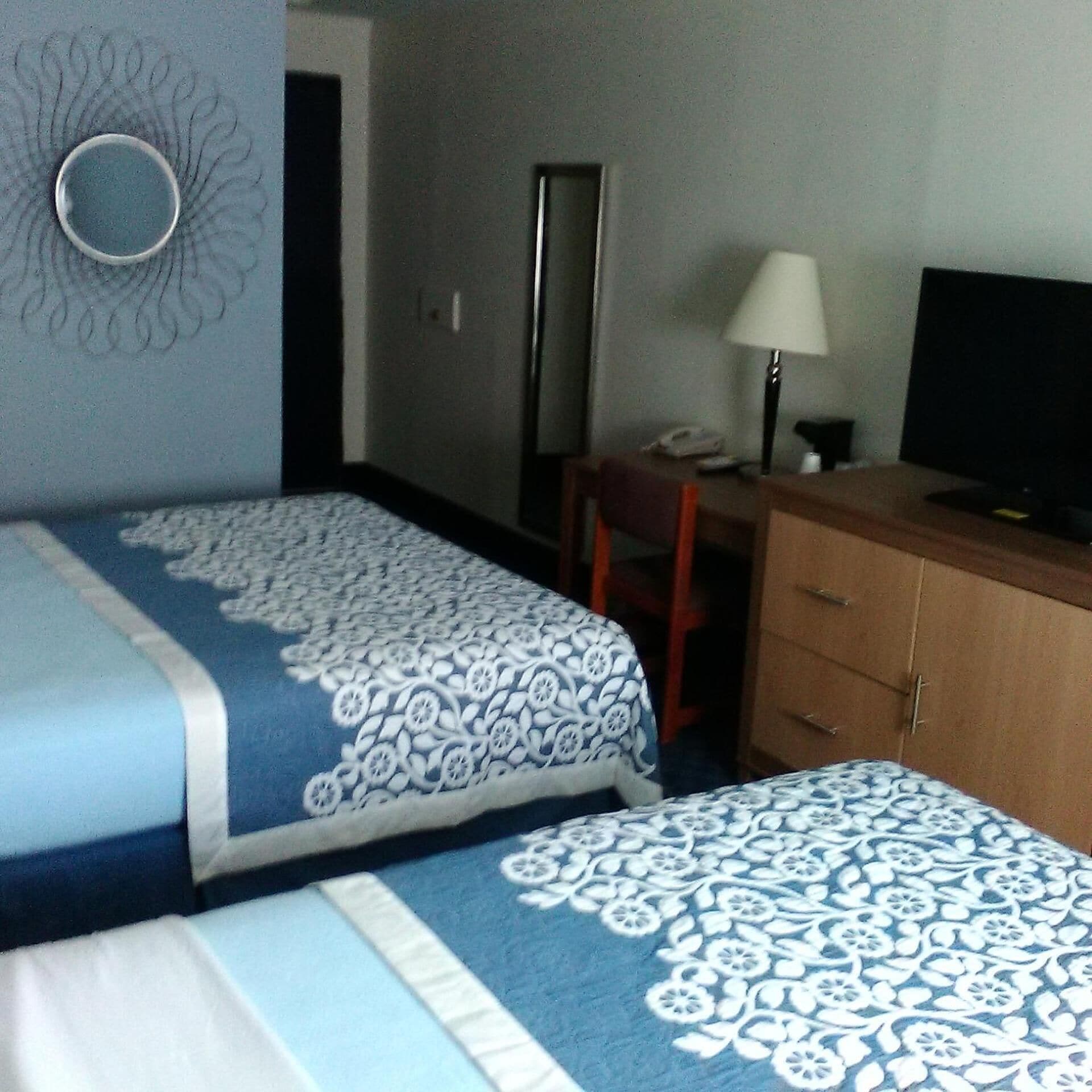 Desk, blackout drapes, iron/ironing board, cribs/infant beds