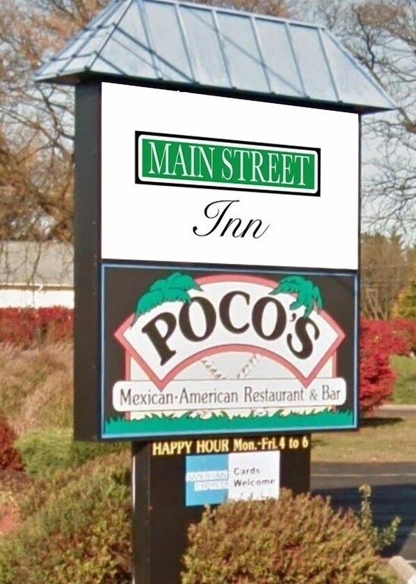 A sign for Main Street Inn, featuring a Poo's Mexican-American Restaurant & Bar logo.