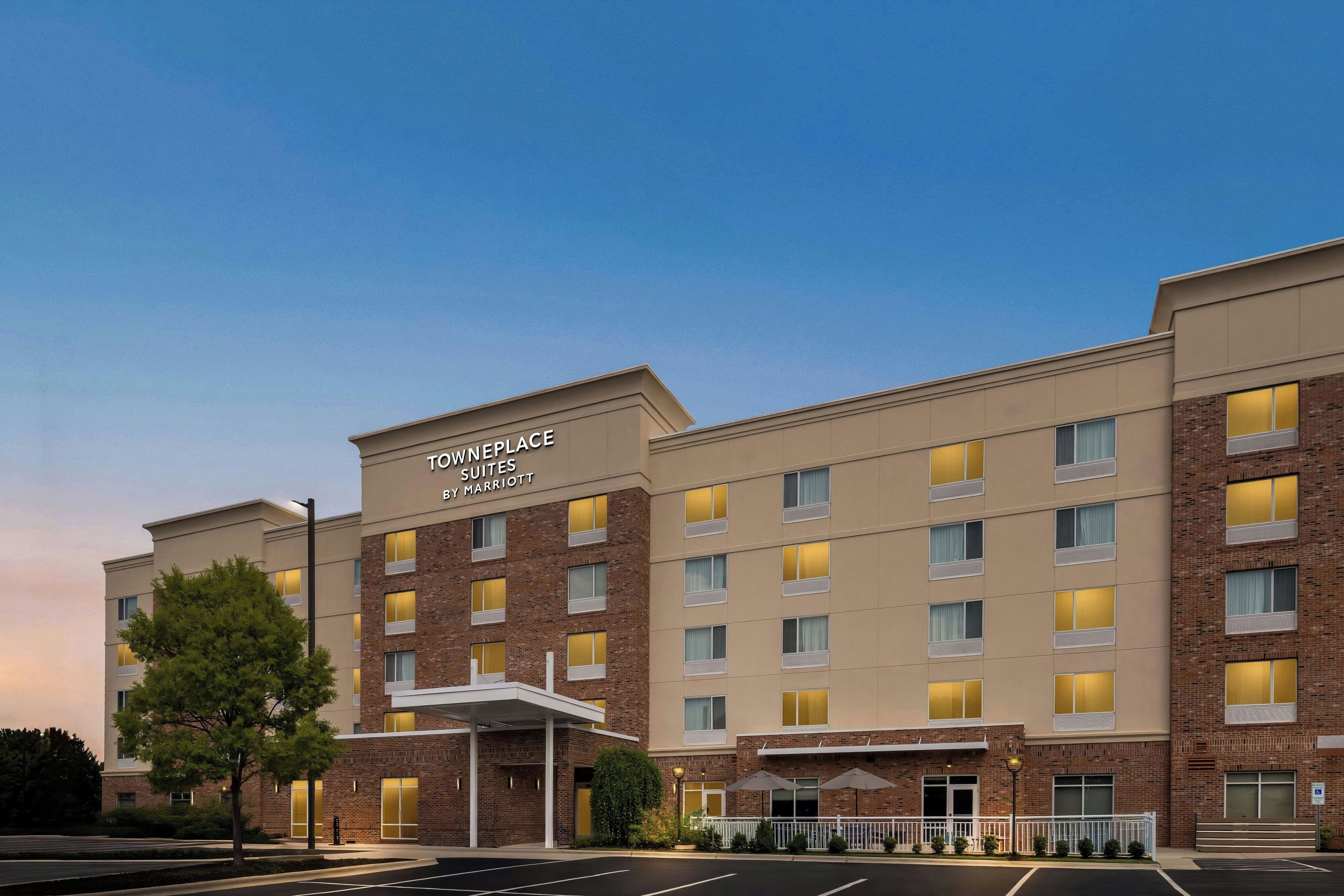 A hotel with a modern facade, multiple floors, and a prominent sign indicating it is a Marriott property.