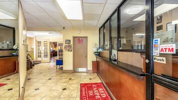 Welcome to the Red Carpet Inn, where guests can check in at the reception desk and access 24-hour ATM service.