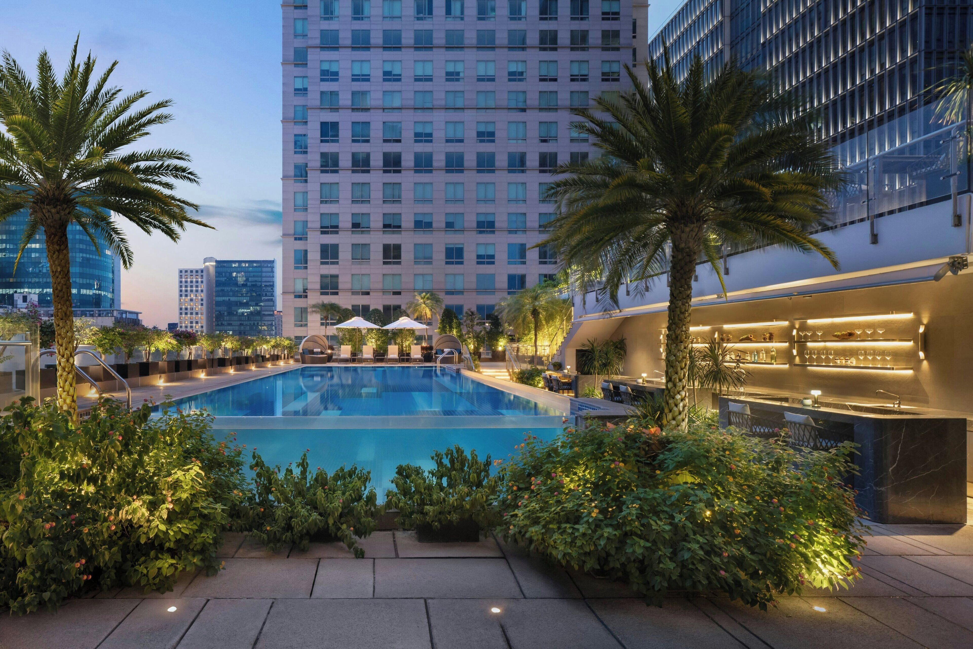 Outdoor pool, open 6:00 AM to 9:00 PM, pool umbrellas, pool loungers