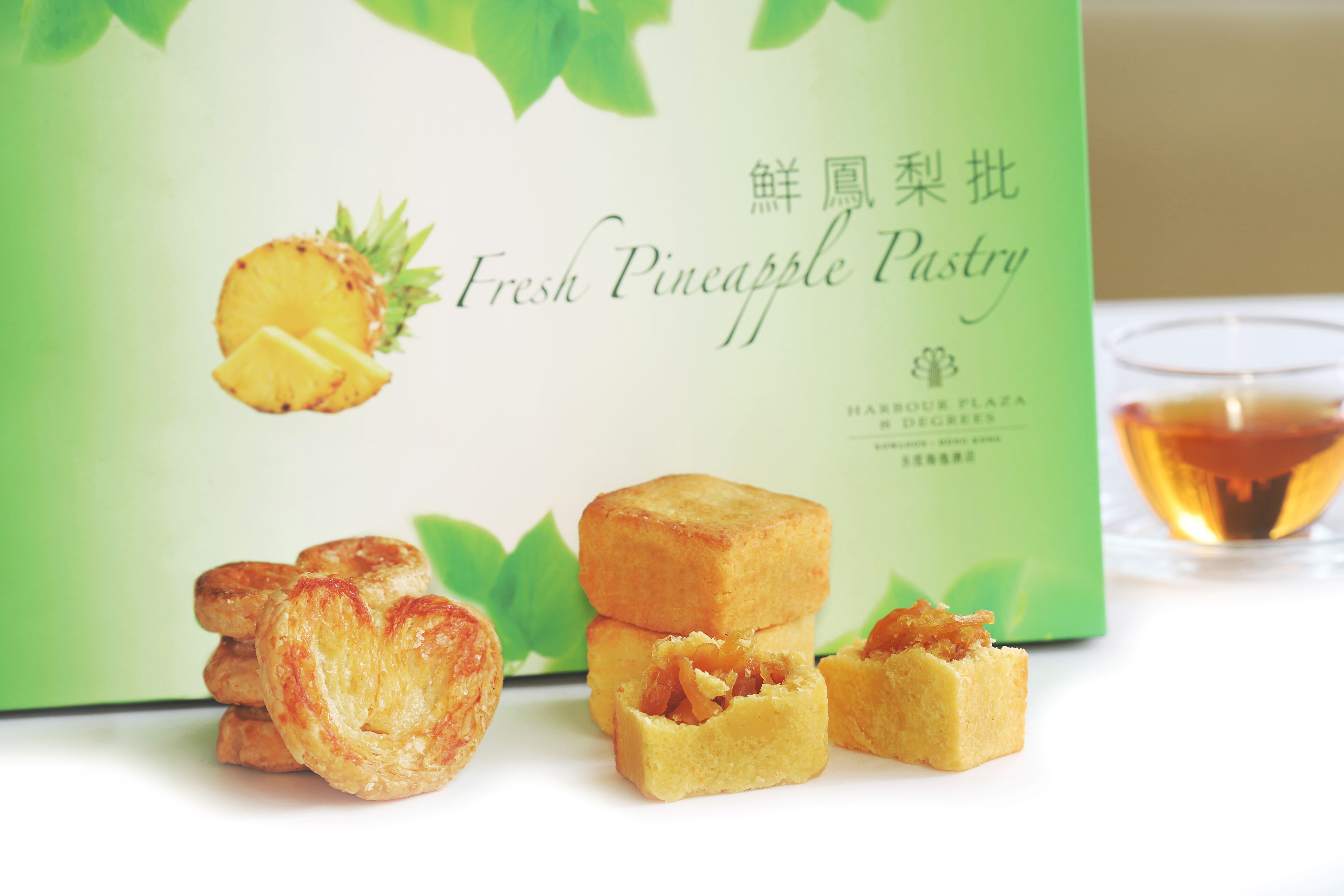 A box of Fresh Pineapple Pastry with a pineapple slice and text in multiple languages.