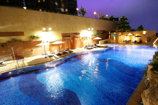 Seasonal outdoor pool, open 9:00 AM to 8:00 PM, pool umbrellas