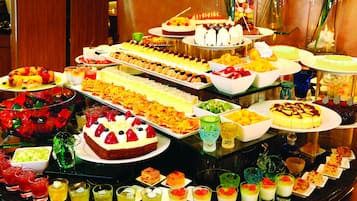 A buffet with various desserts and drinks.