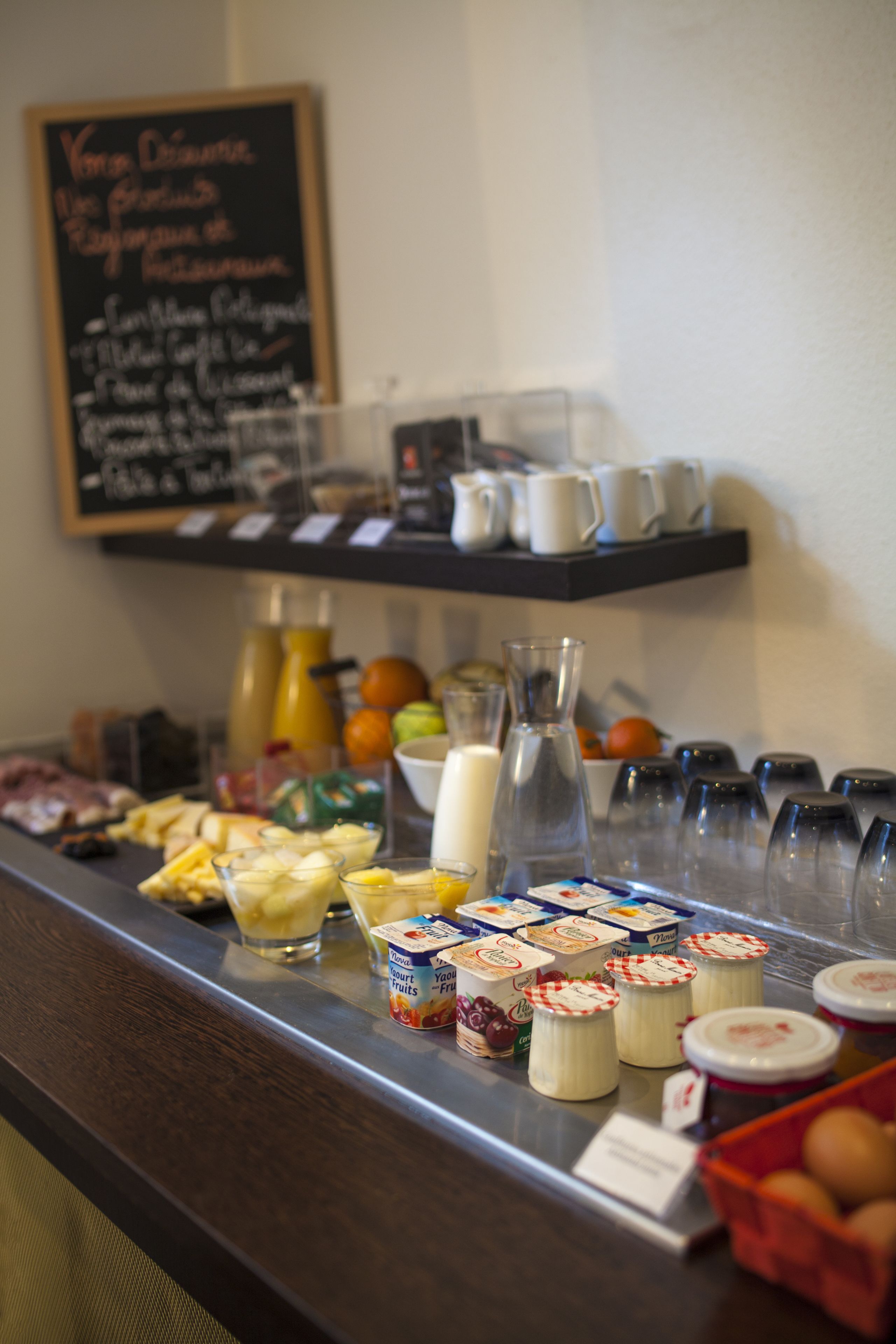 A breakfast buffet with various food items and beverages.