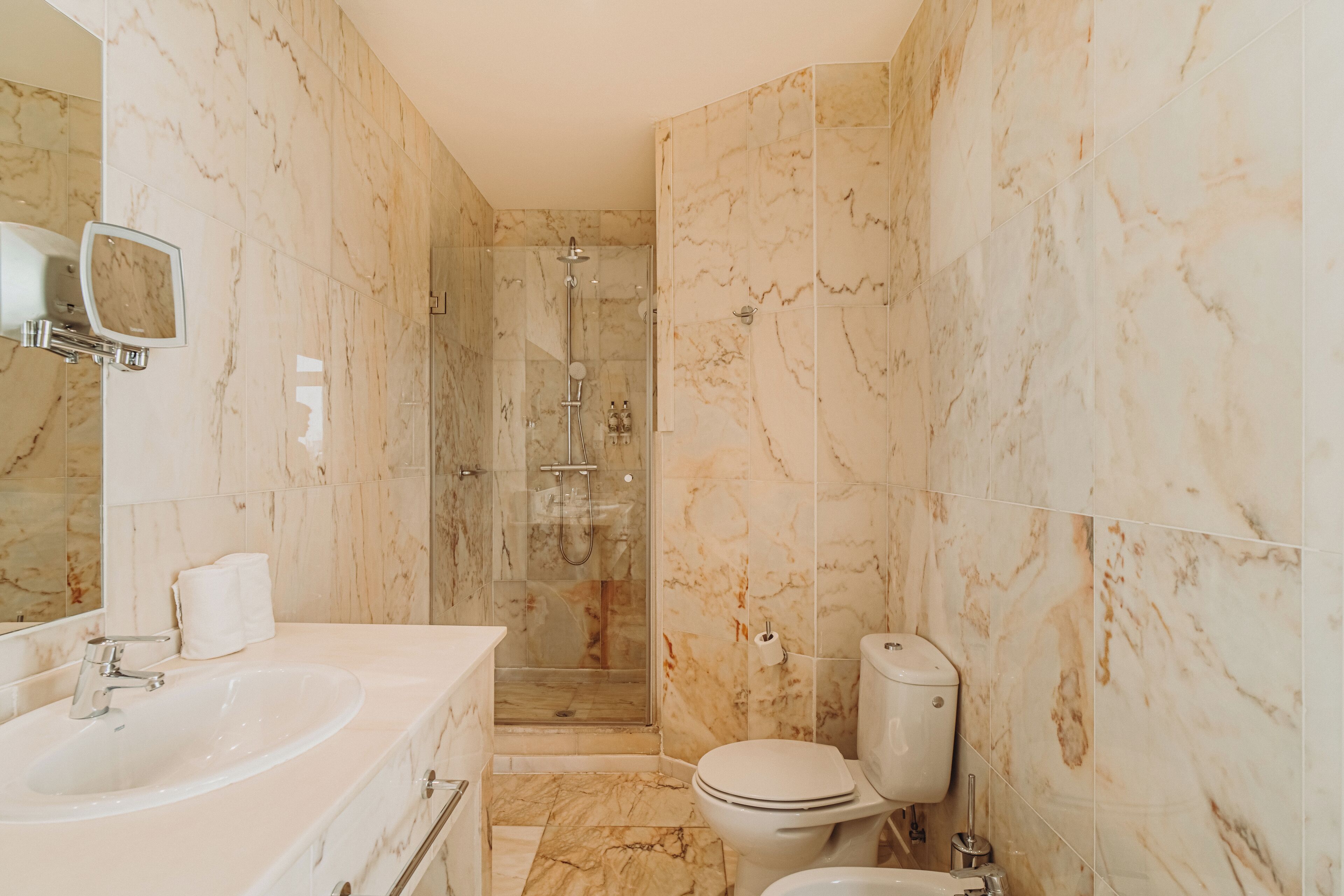 suite | bathroom | shower, rainfall showerhead, hair dryer, bidet