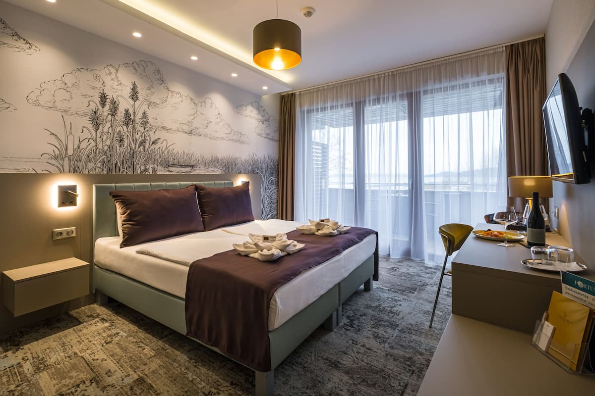 premium double or twin room, lake view | 1 bedroom, minibar, in-room safe, individually decorated