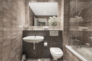 Executive One Bedroom Suite | Bathroom | Designer toiletries, hair dryer, towels, soap