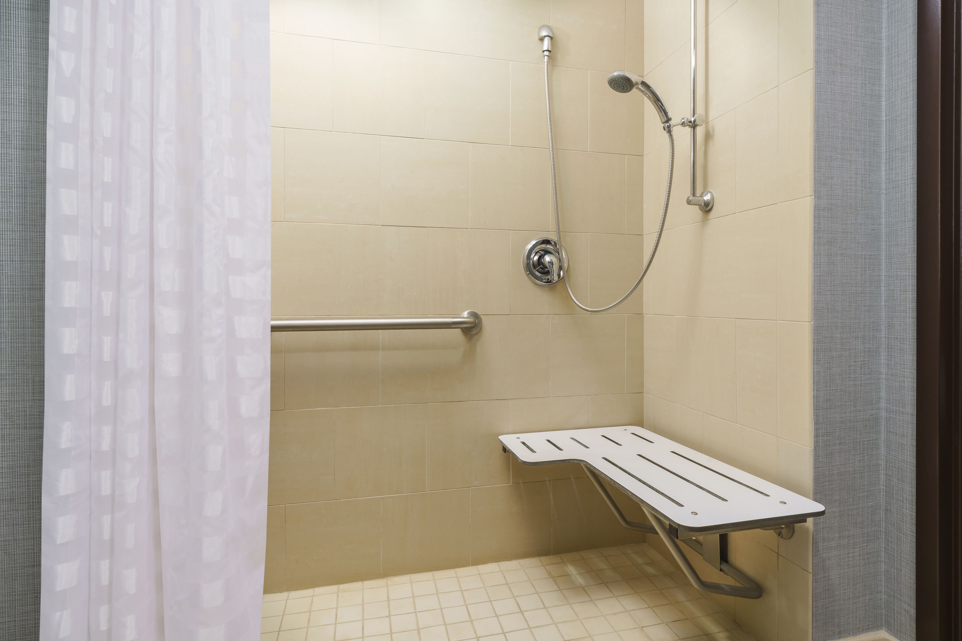 combined shower/bathtub, designer toiletries, hair dryer, towels