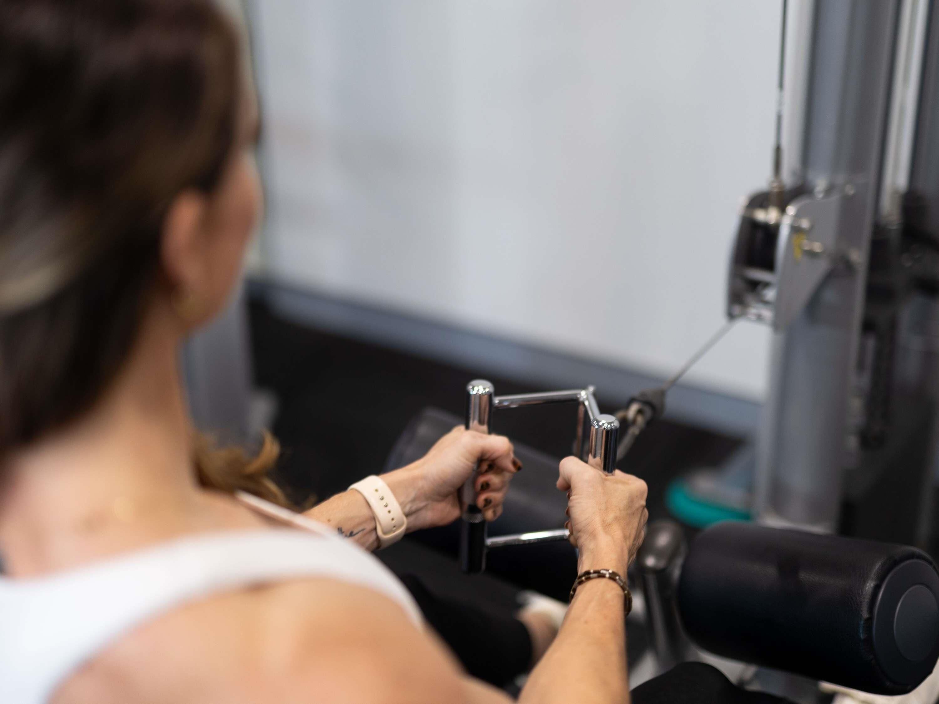 A person using a gym machine.