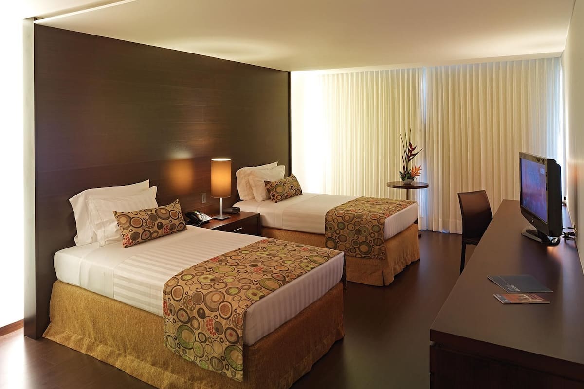 Premium bedding, pillow-top beds, in-room safe, desk