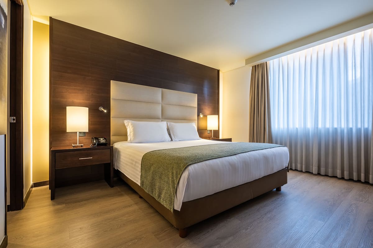 deluxe room, 1 queen bed (deluxe junior suite queen bed) | premium bedding, pillow-top beds, in-room safe, desk