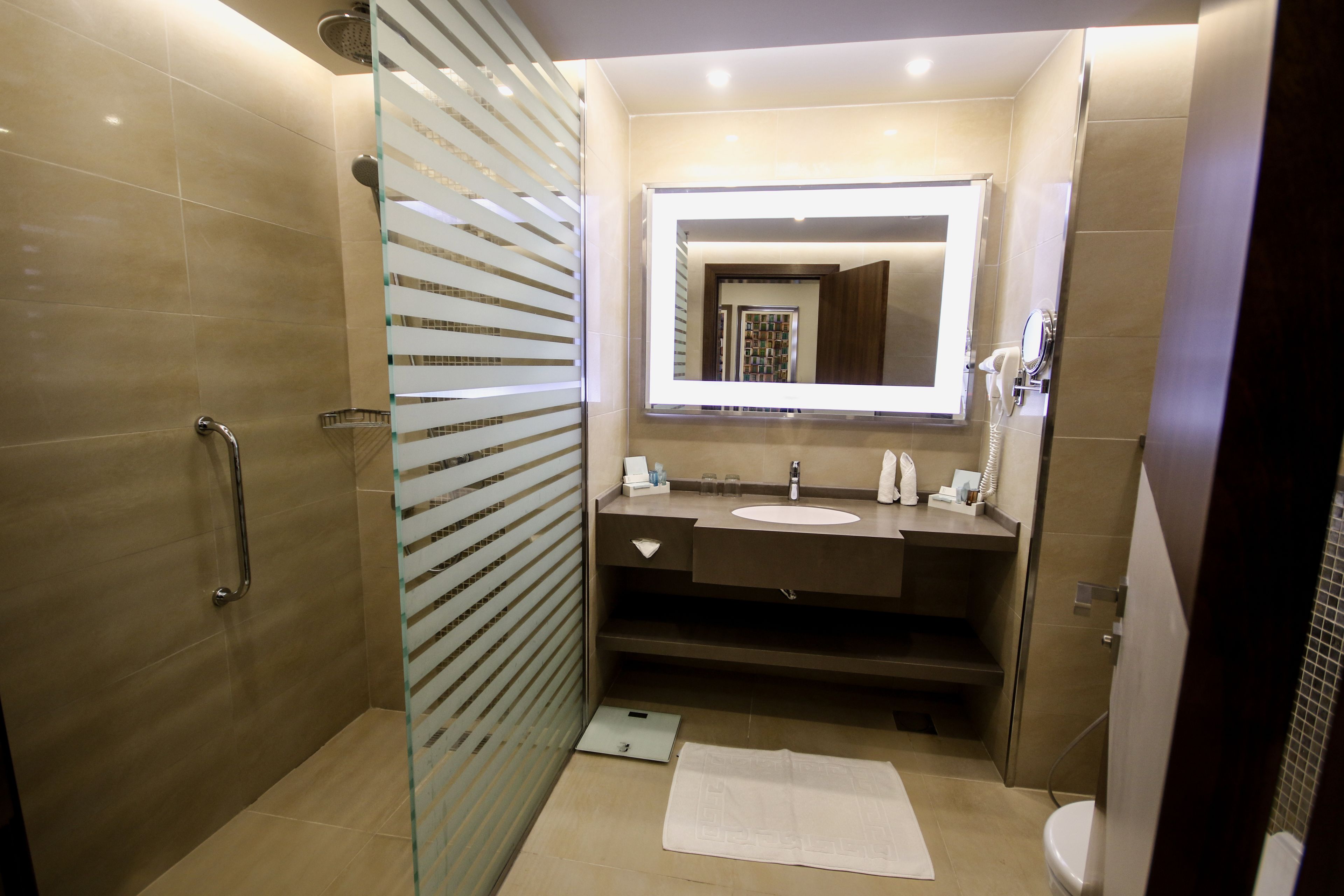 combined shower/bathtub, eco-friendly toiletries, hair dryer, bathrobes
