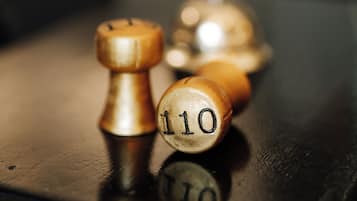A close-up of wooden billiard balls on a table.