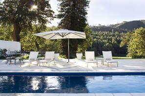Outdoor pool, pool umbrellas, sun loungers