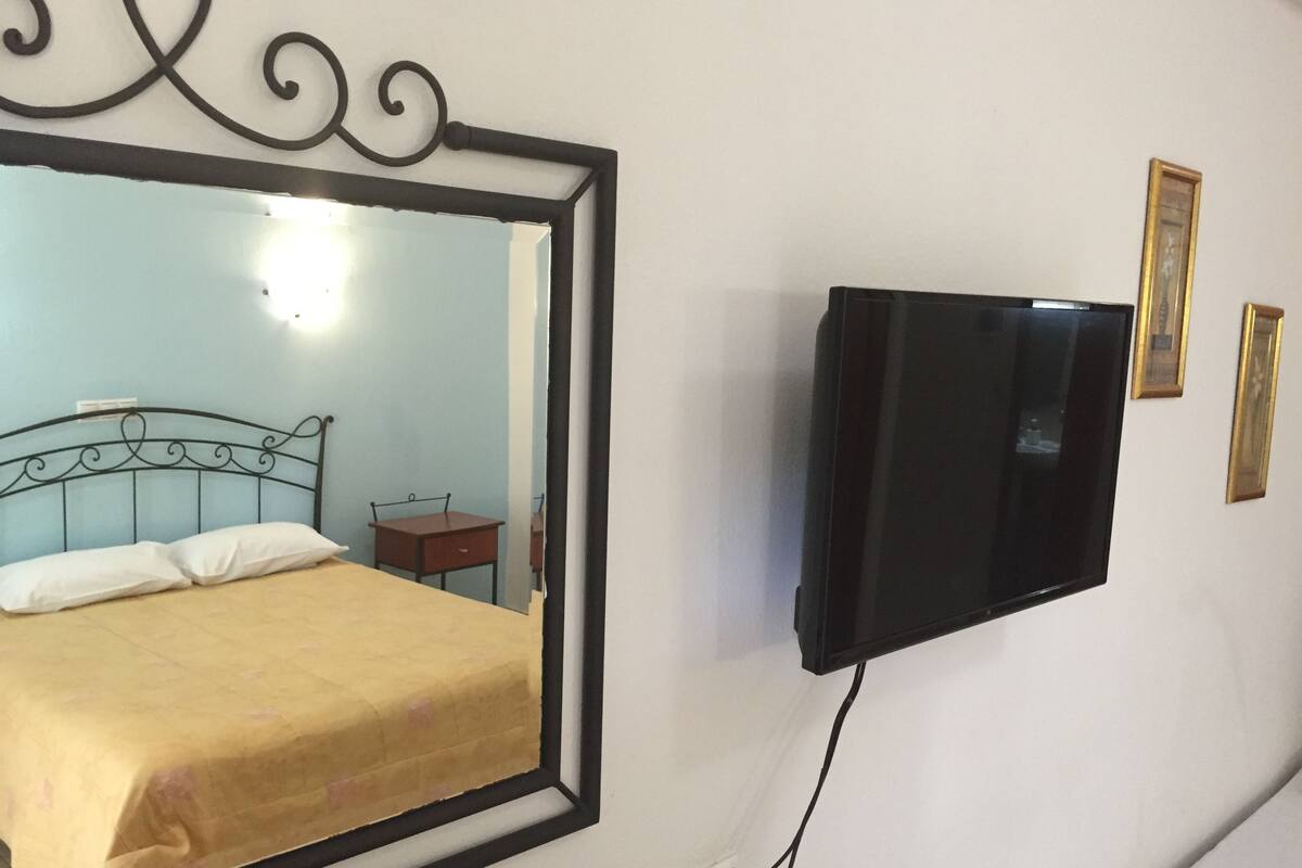 studio | living area | led tv, fireplace