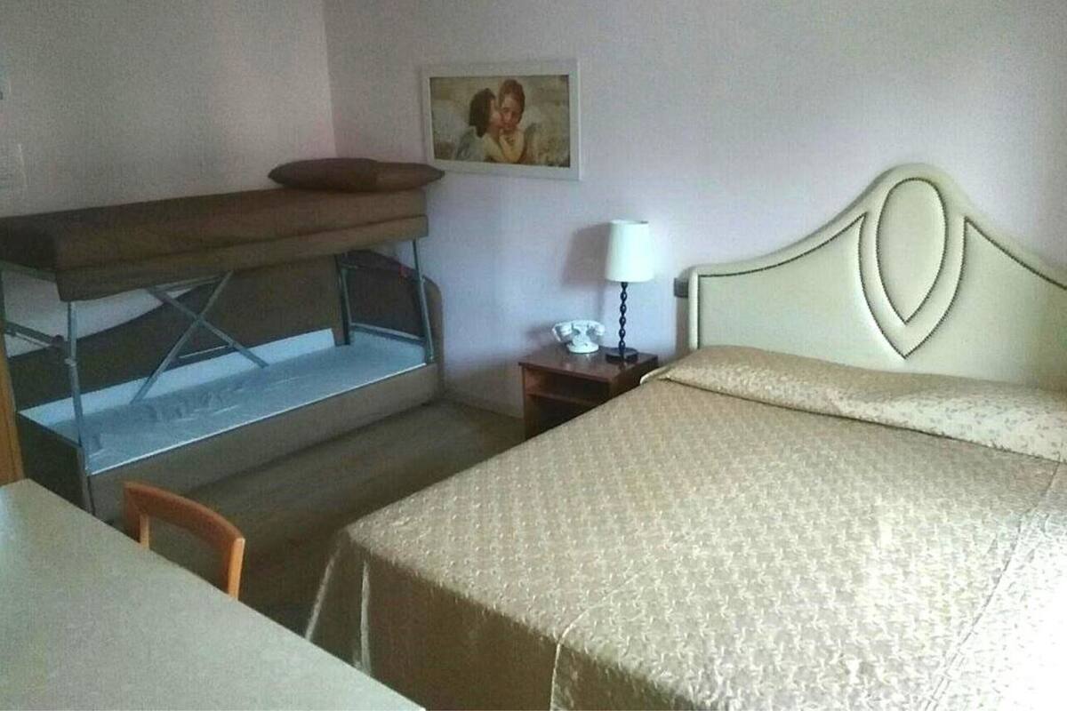 Family Room (Castello) | Minibar, in-room safe, desk, blackout curtains